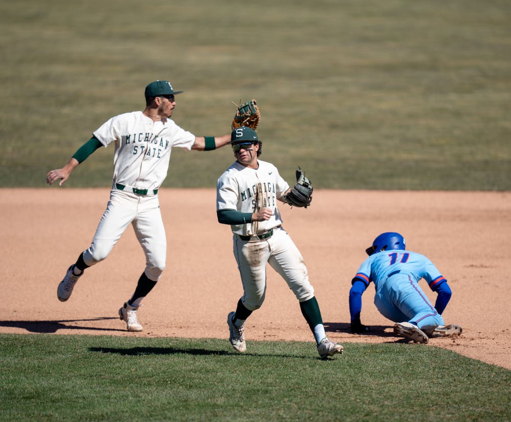 Redshirt junior Peter Ahn and sophmore Trent Farquhar make the perfect team as they get Houston Baptist junior Diego Davila out during the first game on March 20, 2022. Msu won the game 1-0. 