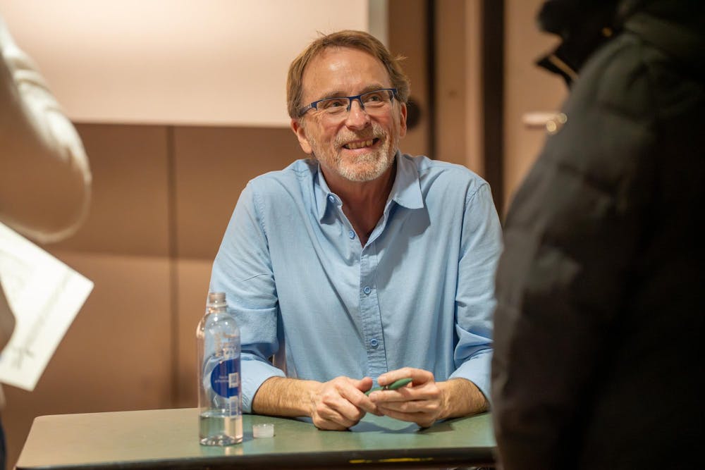 <p>Dennis Hinrichsen speaks to attendees during the book signing portion of the Residential College in the Arts and Humanities’ event after recently moving from San Francisco and attending to explore his new community in East Lansing, Mich., on Feb. 25, 2026.</p>