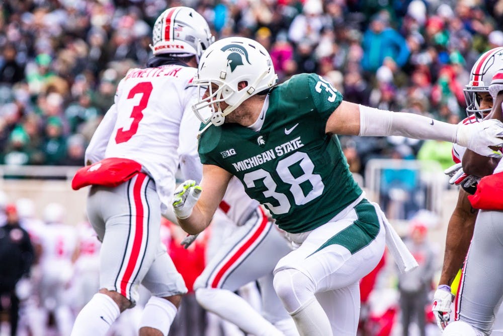 <p>Redshirt senior linebacker Byron Bullough (38) runs upfield on special teams during the game against Ohio State on Nov. 10, 2018.</p>