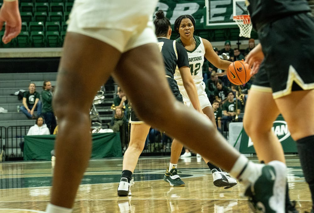 <p>Freshman guard Olivia Porter (42) puts on her game face as she dribbles the ball at the game against Oakland at the Breslin Center on Nov. 15, 2022. The Spartans defeated the Grizzlies 85-39. </p>