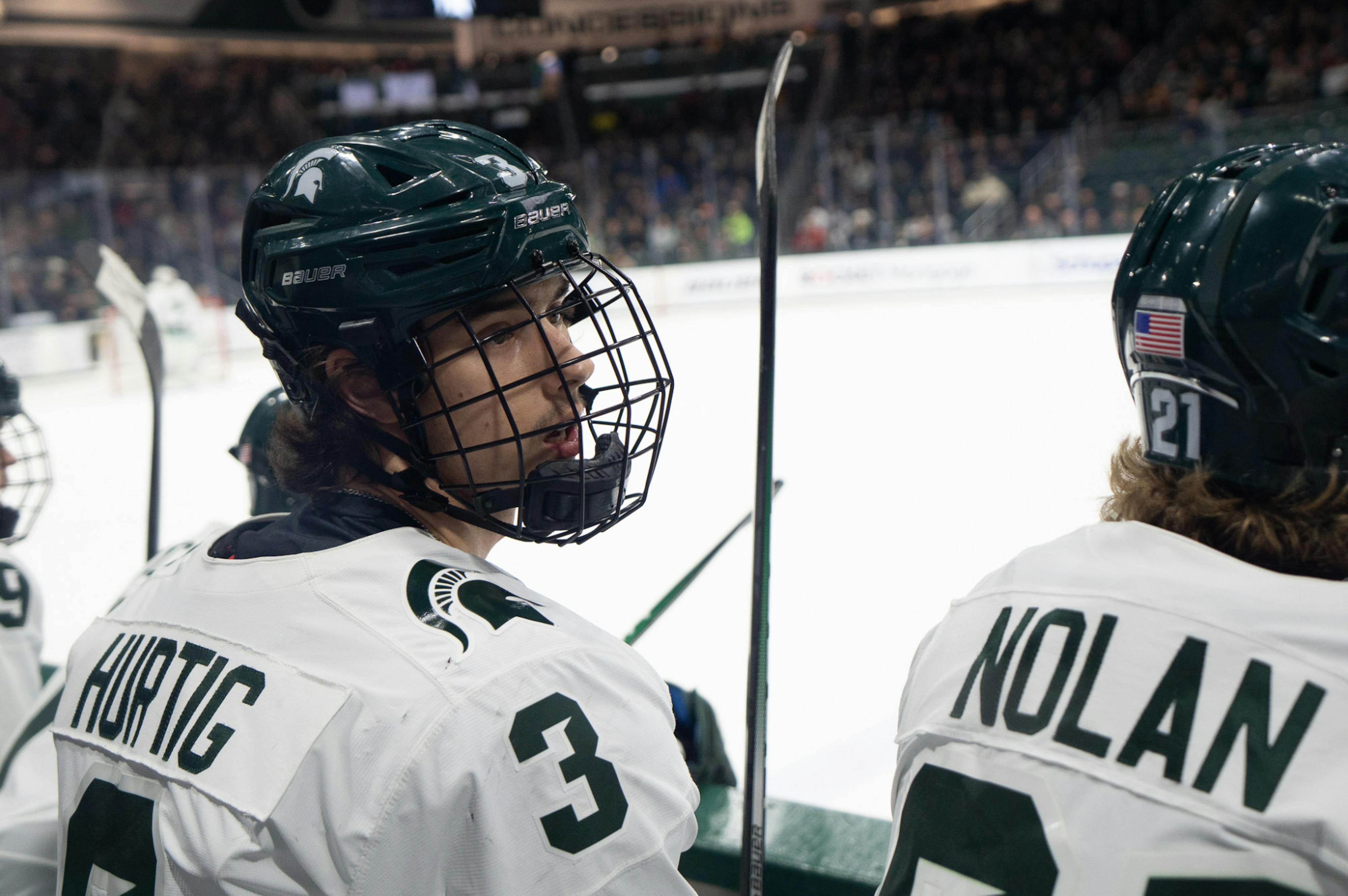 Freshman defenseman Viktor Hurtig looks to his coaches during a game against Penn State University at Munn Ice Arena on Jan. 13, 2023. The Spartans defeated the Nittany Lions with a score of 3-2. 