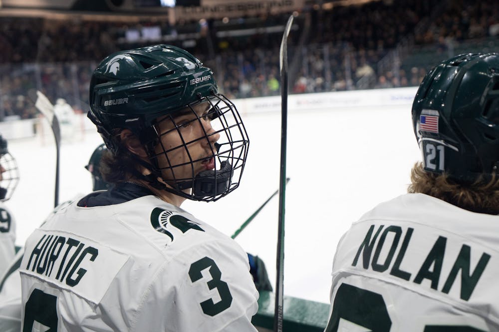 Freshman defenseman Viktor Hurtig looks to his coaches during a game against Penn State University at Munn Ice Arena on Jan. 13, 2023. The Spartans defeated the Nittany Lions with a score of 3-2. 