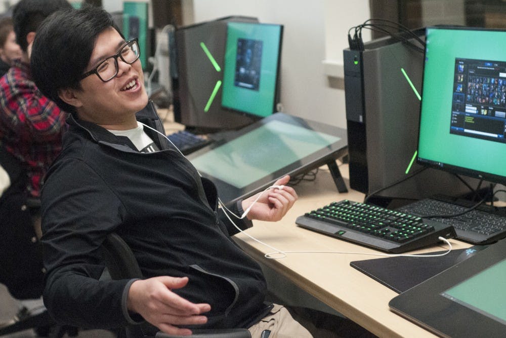Hospitality business senior Vinci Chen communicates with a teammate during the MSU League of Legends Collegiate Team practice on Jan. 31, 2017 at Communication Arts and Sciences Building. The team worked on communication and strategy under the coaching of their manager, chemical engineering junior Kyle Kilponen. "One of the reasons I play this game is because every game is different so it keeps it really refreshing...you can do things where you outplay your opponents and it just makes you feel good," Chen said. 
