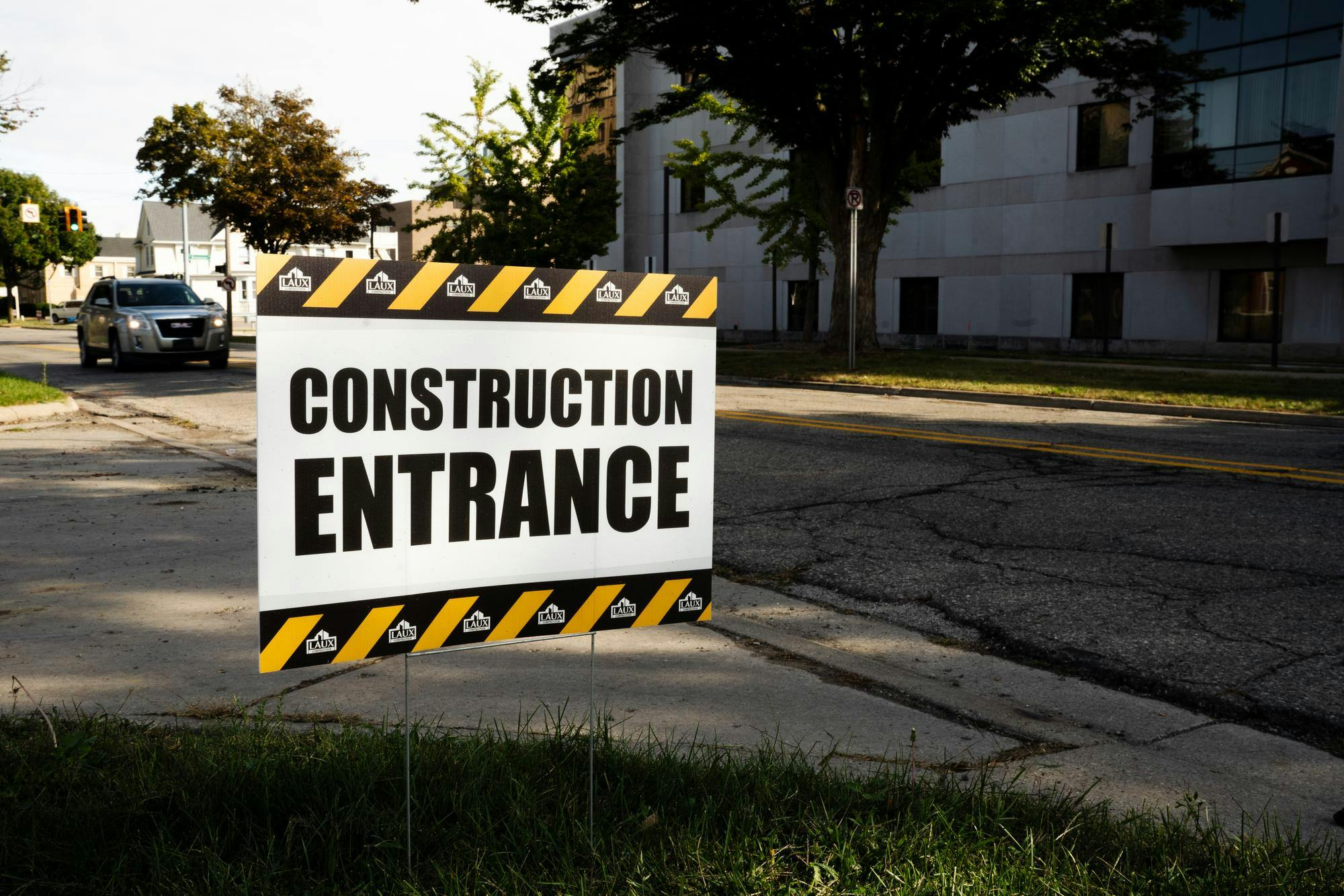 Construction sign for the City Rescue Mission's new homeless shelter in Downtown Lansing on Sep. 25, 2024.