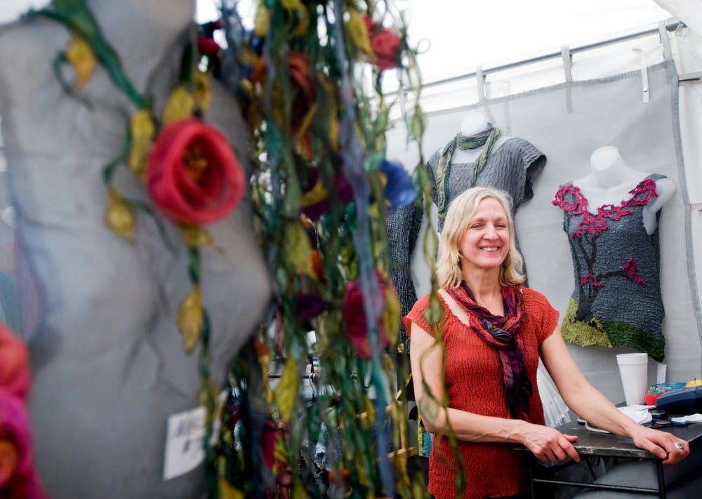 	<p>Leah Dziewit showcases her collection of hand-dyed, silk apparel at the East Lansing Art Festival on May 21, 2011. She has been a returning artist to the festival for almost 20 years. </p>