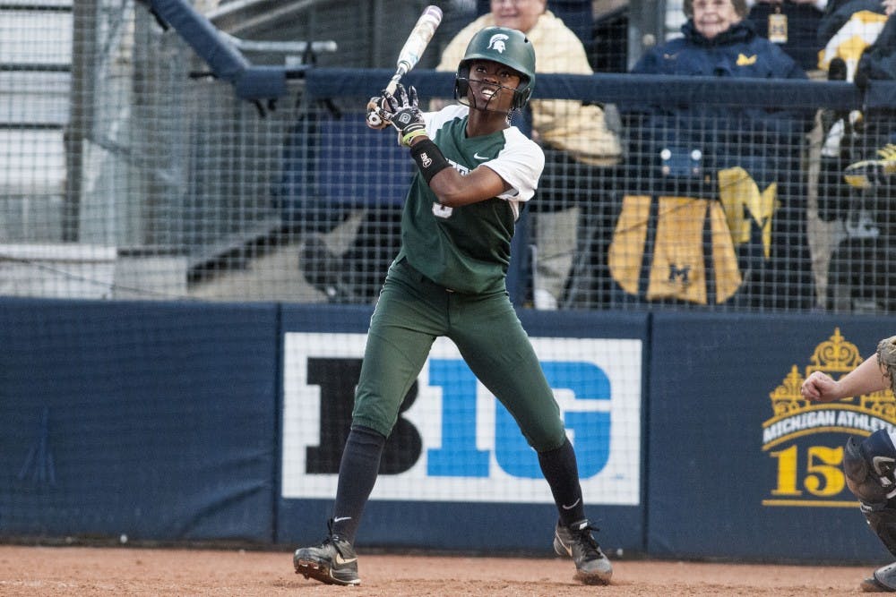 <p>Sophomore utility player Ebonee Echols (3) looks to the ball after hitting it during the game against University of Michigan on April 18, 2017 at Wilpon Baseball and Softball Complex in Ann Arbor. The Spartans were defeated by the Wolverines, 3-1.</p>