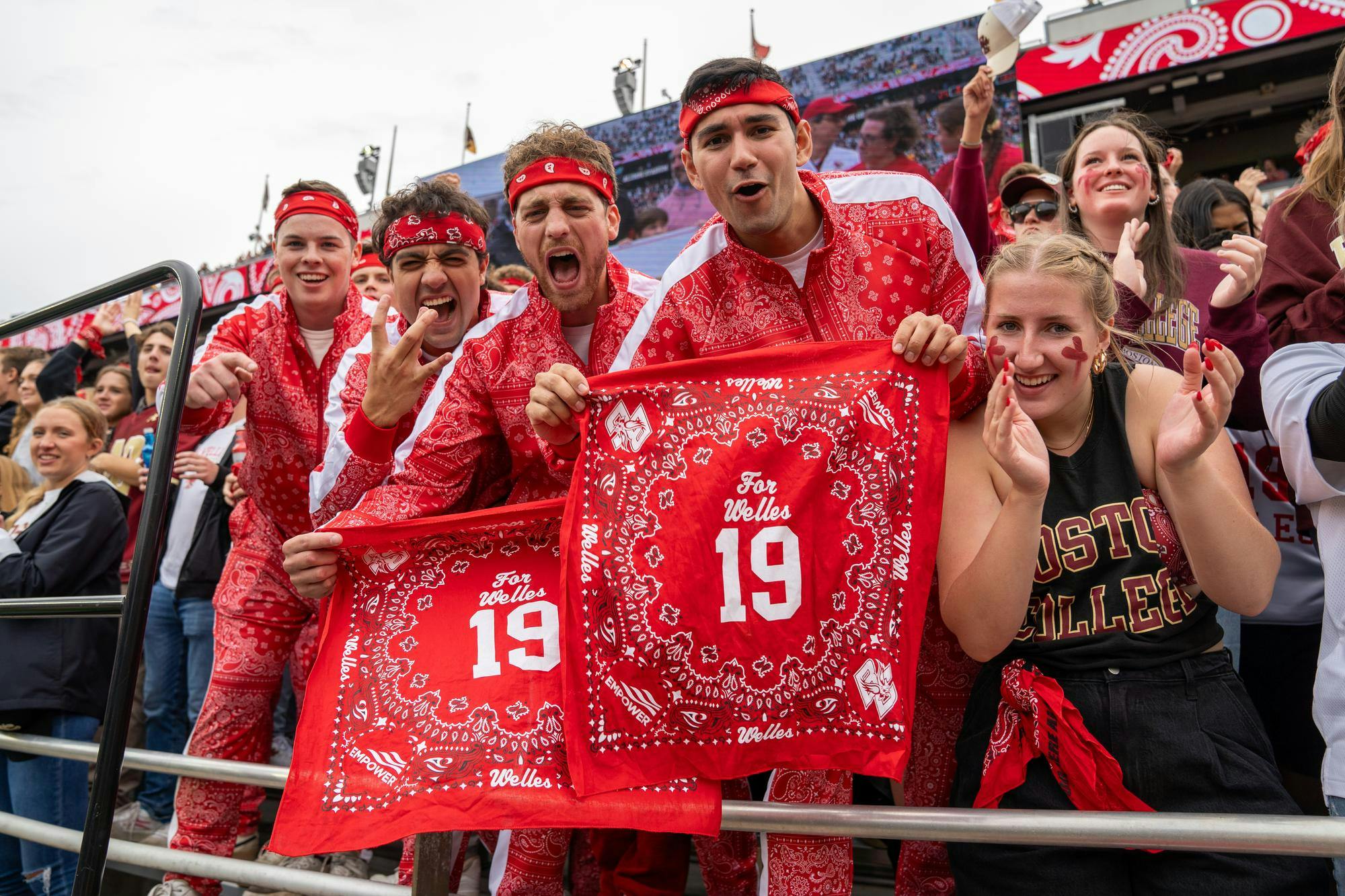 <p>Boston College fans hold up red bandanas honoring fallen 9/11 hero Welles Crowther in a game on Sep. 16, 2023. Photo courtesy of BC Football and Meg Kelly.</p>