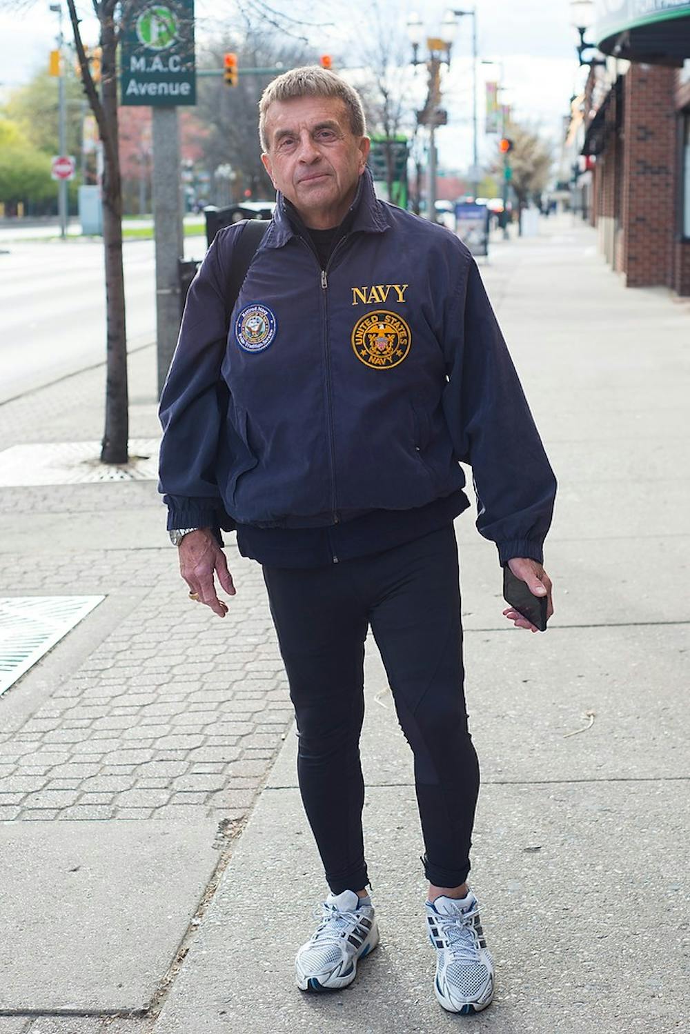 <p>Lansing resident Terry Lee Norton poses for a picture April 27, 2015, on East Grand River Avenue. Norton graduated from MSU in 1969 and has stayed in the area ever since. Hannah Levy/The State News</p>