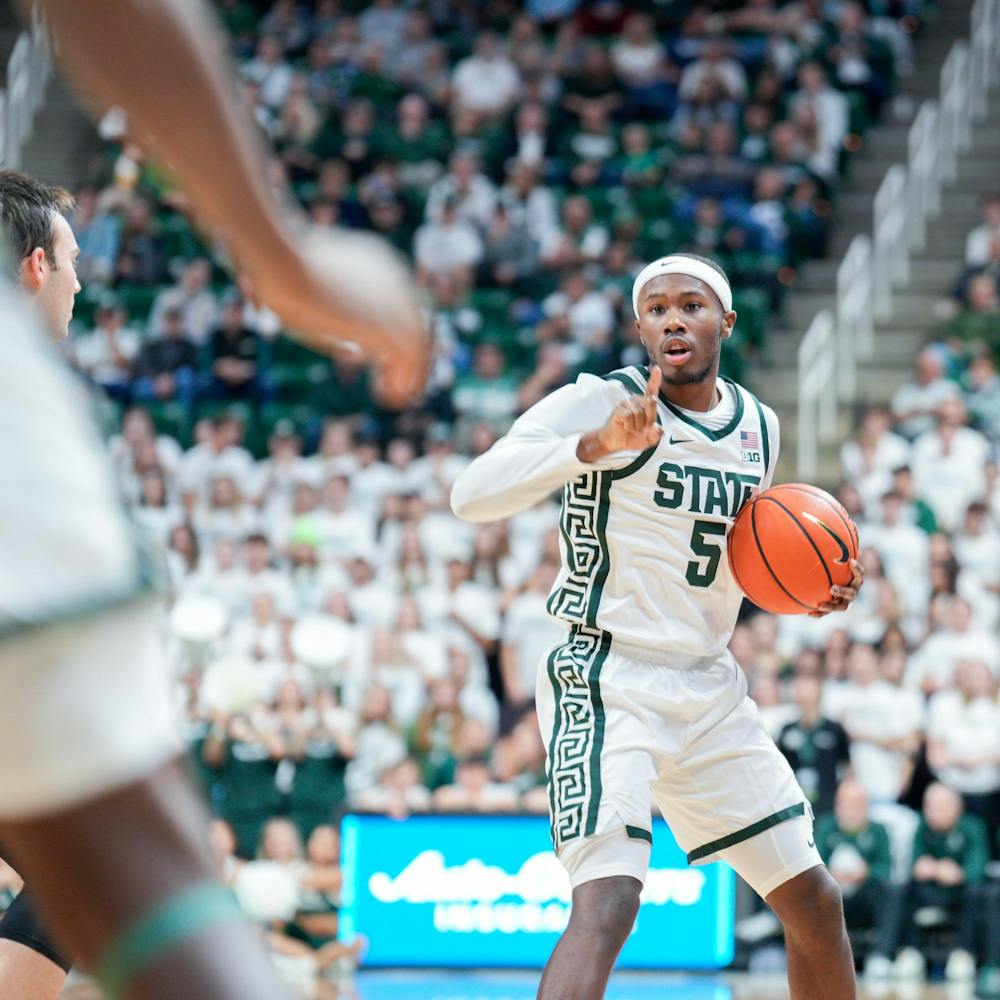 Sophomore guard Tre Holloman (5) with the ball during a game against Hillsdale at the Breslin Center on Oct. 25, 2023. The Spartans defeated the Chargers 85-43. 