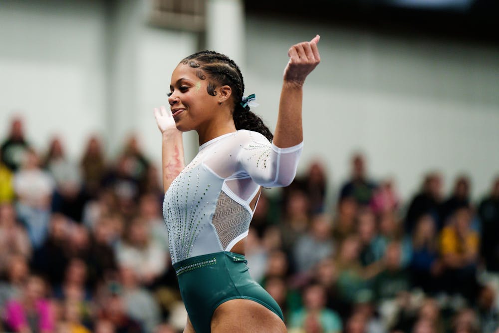 <p>Senior Nyah Smith during her floor routine in a meet against University of Michigan, held at Jenison Field House on Jan. 22, 2023. The Spartans upset the No. 3 ranked Wolverines with 197.200 points.</p>