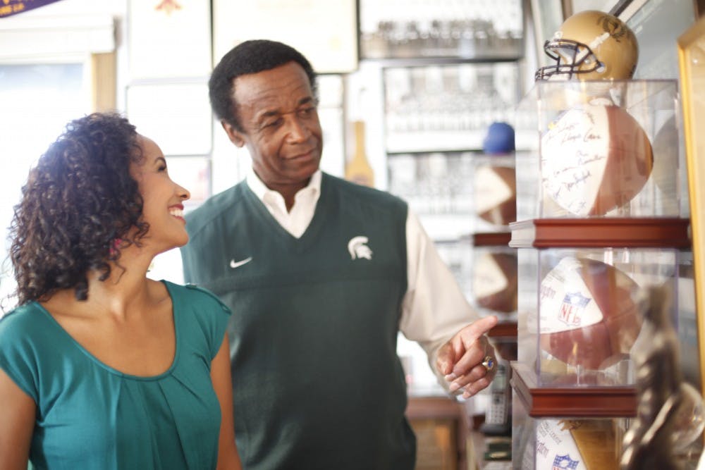 <p>Former Michigan State wide receiver Gene Washington with his daughter, Maya. Maya's film "Through the Banks of the Red Cedar" chronicles Gene and his teammates from the 1956-66 MSU football team. Photo courtesy: Through the Banks of the Red Cedar</p>