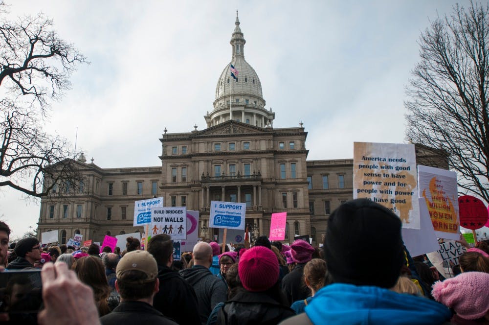 on Jan. 21, 2017 at the Capital Building in Lansing. Activists gathered and expressed their opinions.