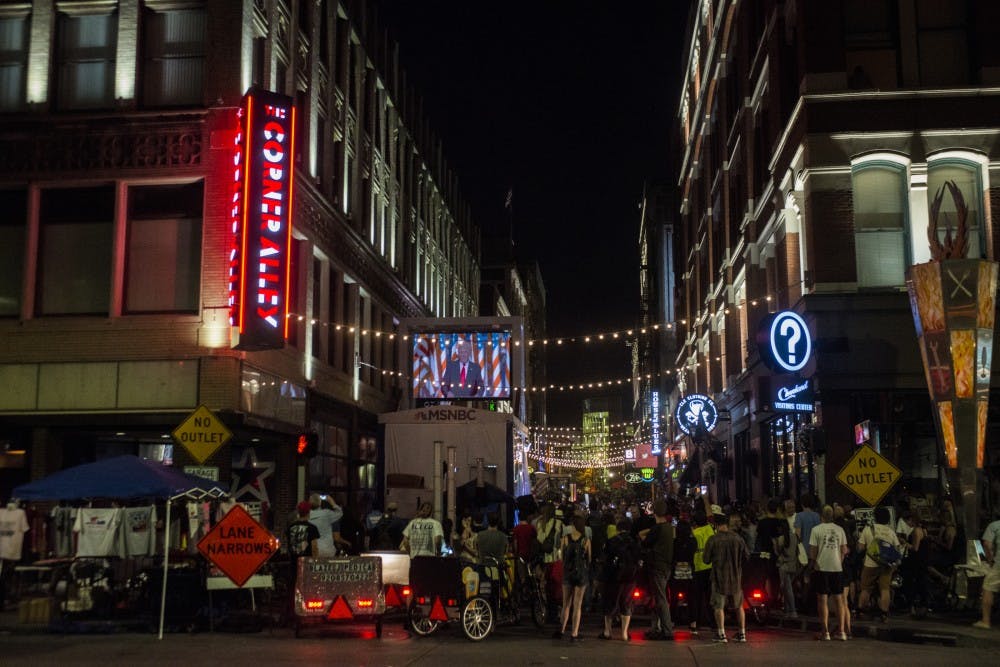 People gather to watch Donald Trump accept Republican nomination on July 21, 2016 at on 4th St. in Cleveland, Ohio