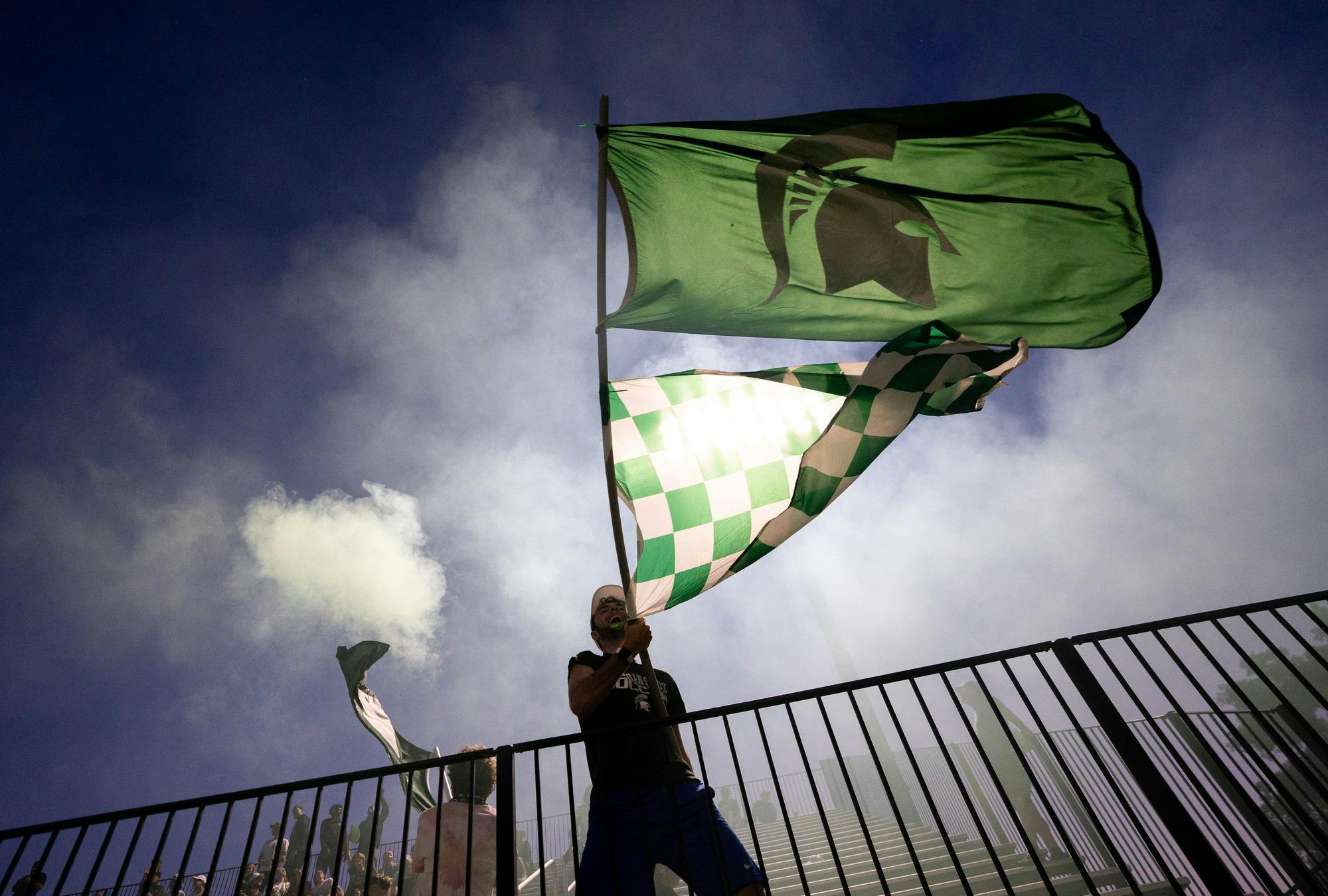 <p>The Red Cedar Rowdies wave MSU flags in the air after a goal from the Spartans at DeMartin Stadium on Sept. 19, 2024. The Michigan State University Spartans defeated the University of Nebraska Huskers 4-1 during the Spartans' first home conference match of the year.</p>