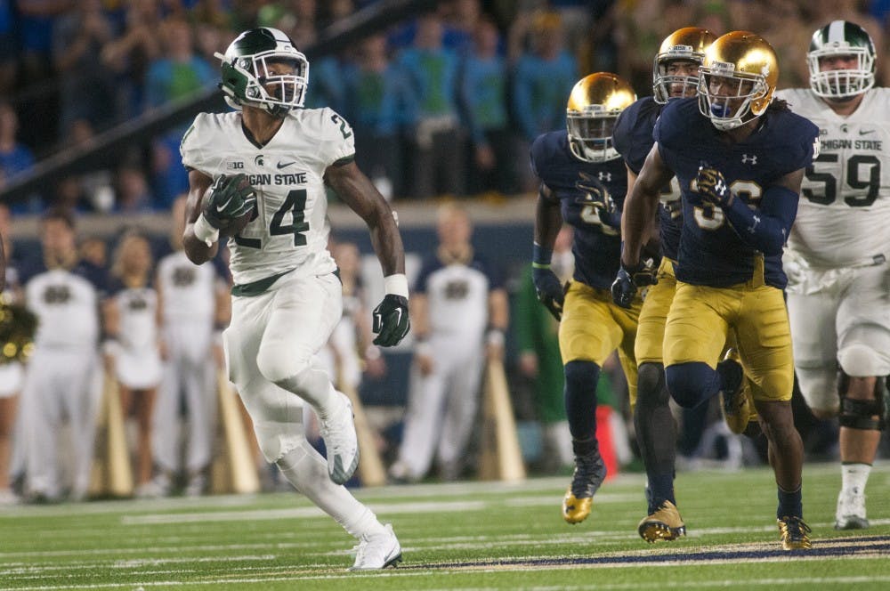 Junior running back Gerald Holmes (24) runs down the field for a touchdown during the game against Notre Dame on Sept. 17, 2016 at Notre Dame Stadium in South Bend, Ind. The Spartans defeated the Fighting Irish, 36-28.