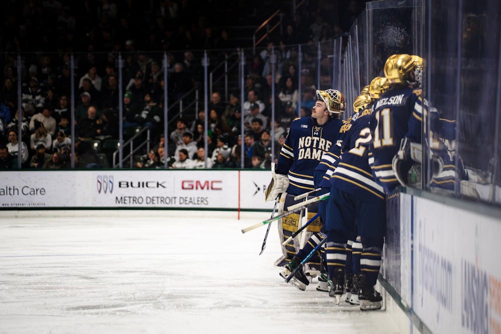 Notre Dame graduate student, Luke Pearson (30), looks up at the stands at Munn Ice Arena in East Lansing, Michigan, on Friday, Feb. 20, 2026
