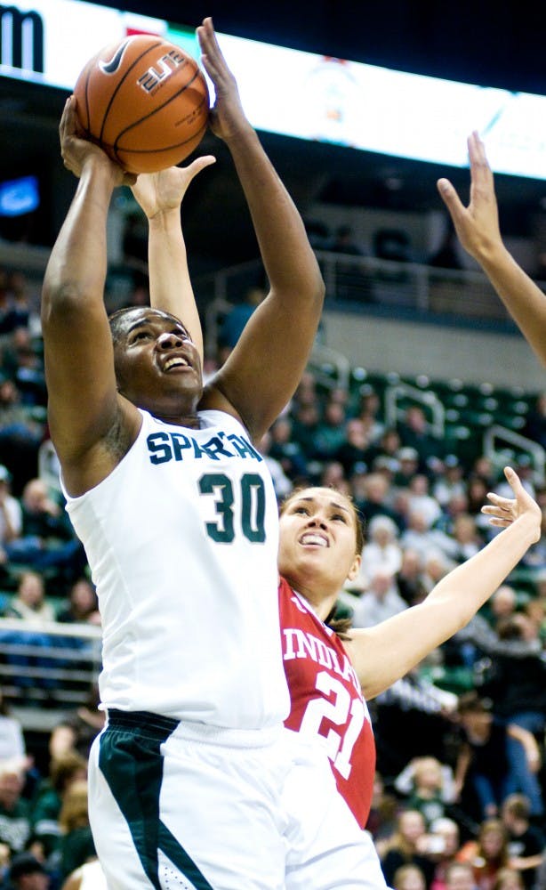Red shirt senior Lykendra Johnson goes up for a lay up against forward Danilsa Andujar Thursday night at Breslin Center. The spartans pulled away in the second half coming up with a 67-47 victory over the Indiana Hoosiers. Aaron Snyder/The State News. 
