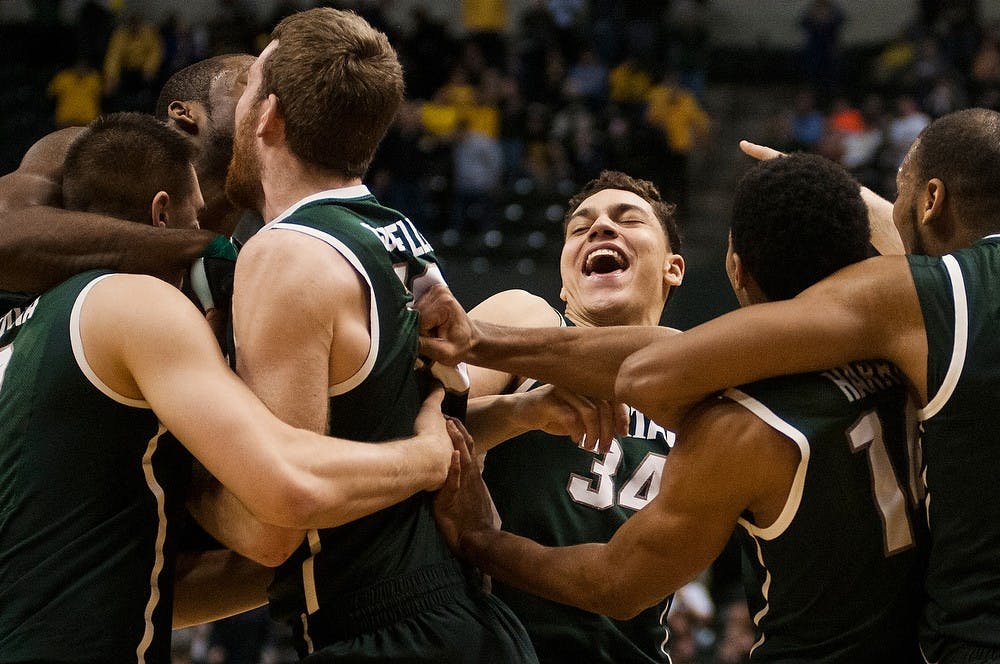 <p>Freshman forward Gavin Schilling rejoices with his team for their Big Ten Championship win March 16, 2014, after the game against Michigan at Bankers Life Fieldhouse in Indianapolis. The Spartans defeated the Wolverines, 69-55. Erin Hampton/The State News</p>