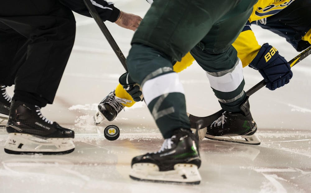 <p>A referee drops the puck during a face off between Michigan State and the University of Michigan at the Yost Ice Arena in Ann Arbor, Mich. on Dec. 6, 2025.</p>
