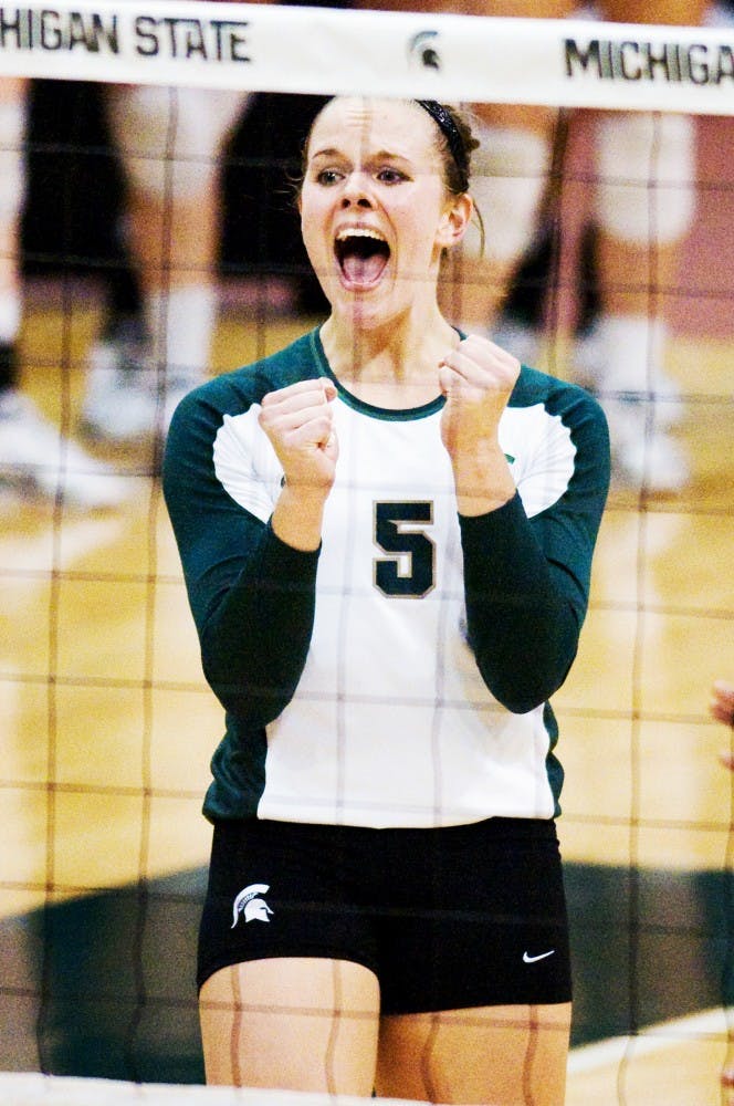 Senior outside hitter Jenilee Rathje reacts to play Wednesday at Jenison Field House. The Spartans defeated the Michigan Wolverines 3-1. Matt Radick/The State News