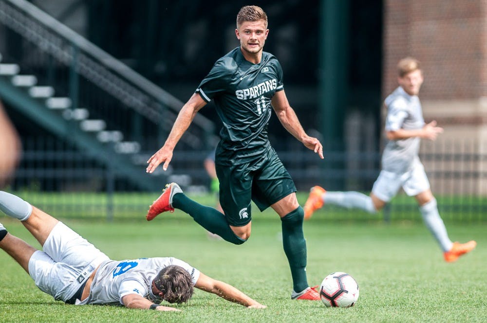 Senior forward Ryan Sierakowski (11) looks for a pass during the game against Tulsa on August 26, 2018 at DeMartin Stadium. The game ended in a draw between the Spartans and Golden Hurricanes.  