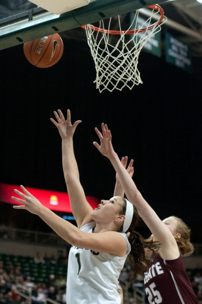 	<p>Freshman guard Tori Jankoska goes up for the basket as Colgate forward Josie Stockill defends Dec. 29, 2013, at Breslin Center. The Spartans won, 96-46. Julia Nagy/The State News</p>