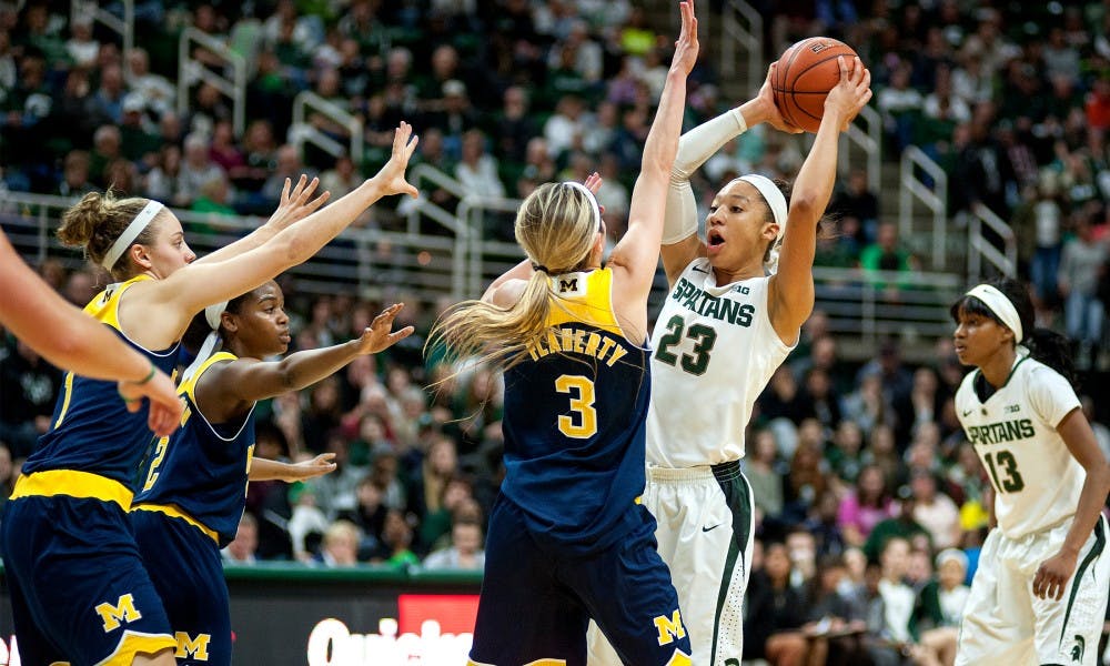 Junior forward Aerial Powers looks to pass the ball as she is blocked by Michigan guard Katelynn Flaherty during during the game against Michigan on Feb. 3, 2016 at Breslin Center. The Spartans defeated the Wolverines, 85-64.