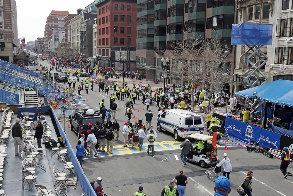	<p>Emergency personnel assist the victims at the scene of a bomb blast during the Boston Marathon in Boston on Monday, April 15, 2013.</p>