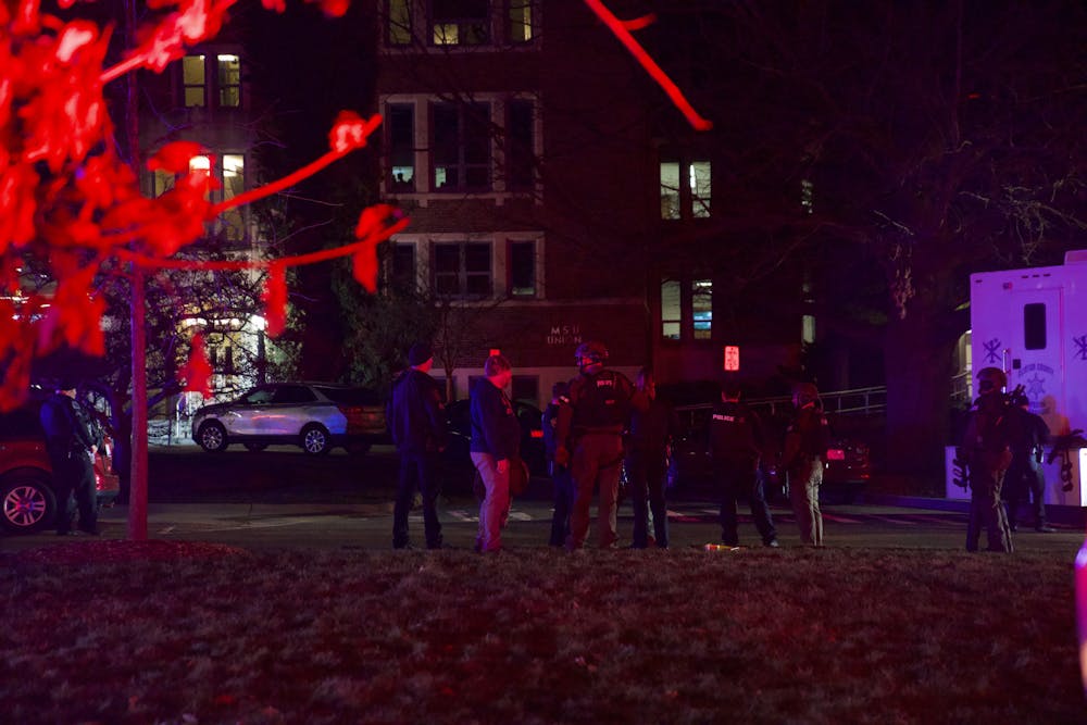 <p>Police stand outside of the Union after an active shooting on Michigan State University's campus on Monday, Feb. 13, 2023.</p>