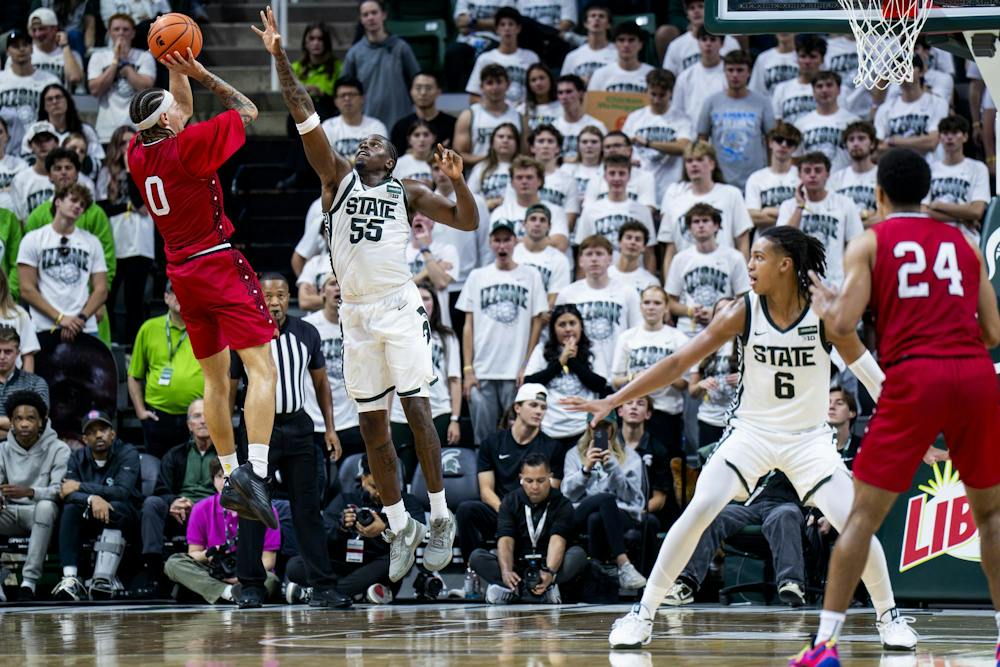 <p>Incarnate Word forward D'Arrae Goodwin (0) attempts a shot as Michigan State forward Coen Carr (55) defends during the Michigan State vs. Incarnate Word men's basketball exhibition game at Breslin Center in East Lansing, Mich., on Friday, Oct. 2, 2026.</p>