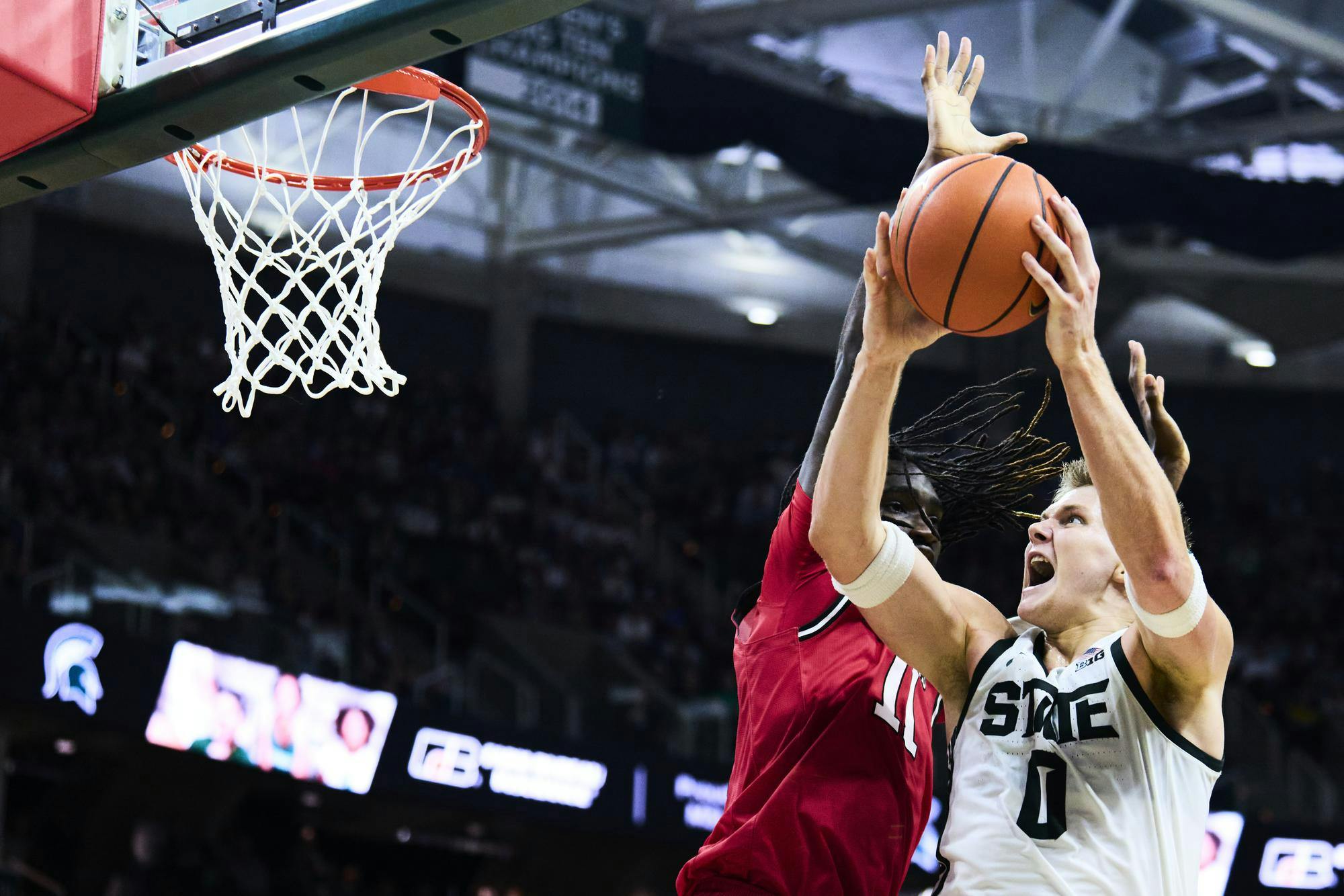 <p>Rutgers Scarlet Knights forward Chris Nwuli (11) defends Michigan State Spartans forward Jaxon Kohler (0) during a men’s basketball game at the Breslin Center at Michigan State University in East Lansing, Mich., on Thursday, March 5, 2026.</p>