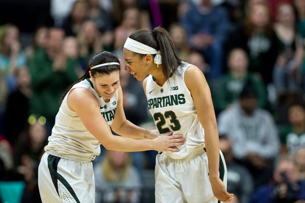 Junior guardTori Jankoskam left, and junior forward Aerial Powers  celebrate after scoring during the game against Ohio State on Feb. 27, 2016 at Breslin Center. The Spartans defeated the Buckeyes, 107-105 in triple overtime.