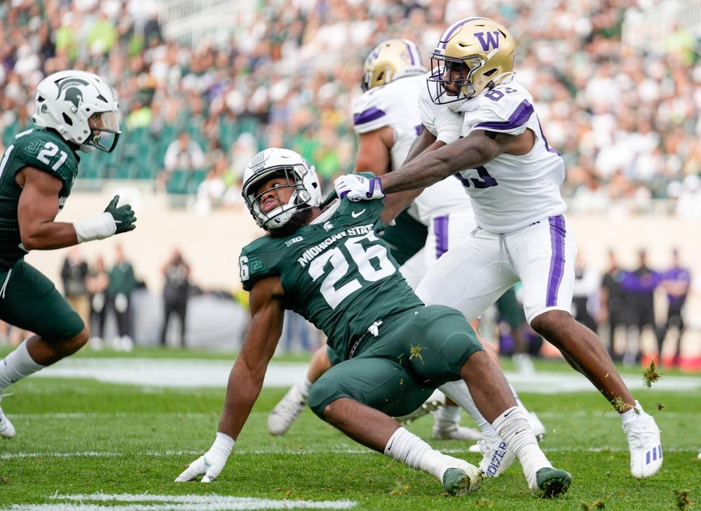 Redshirt senior defensive lineman Brandon Wright (26) falls while attempting to defend against University of Washington players during a game against University of Washington at Spartan Stadium on Sept. 16, 2023.