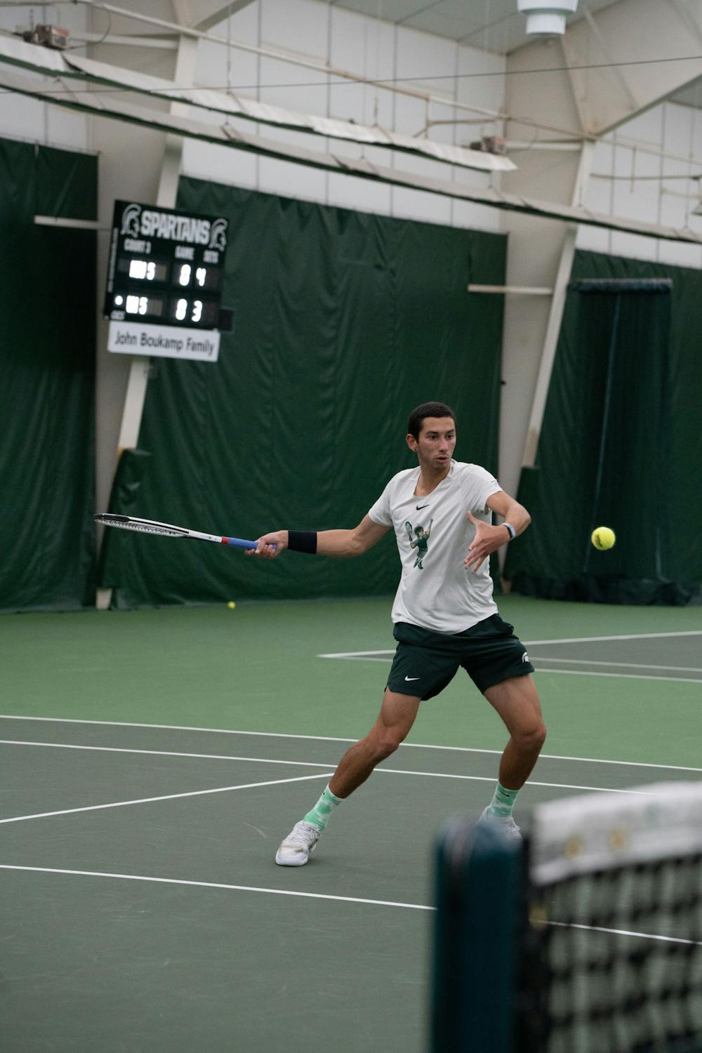 <p>Freshman Ozan Baris gets ready to return the ball during his singles against Michigan senior Ondrej Styler at the MSU Tennis Center on March 30, 2023. The Spartans lost to the Wolverines 6-1.</p>