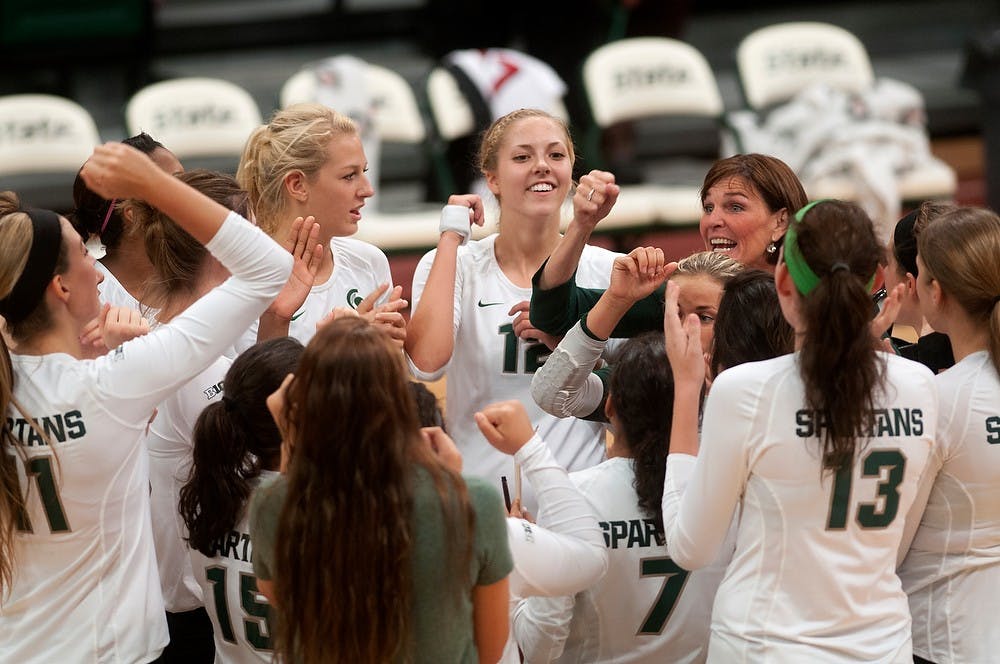 <p>The Spartans celebrate after a win against Western Kentucky on Sept. 19, 2014, at Jenison Field House. The Spartans defeated the Big Reds, 3-0. Jessalyn Tamez/The State News</p>