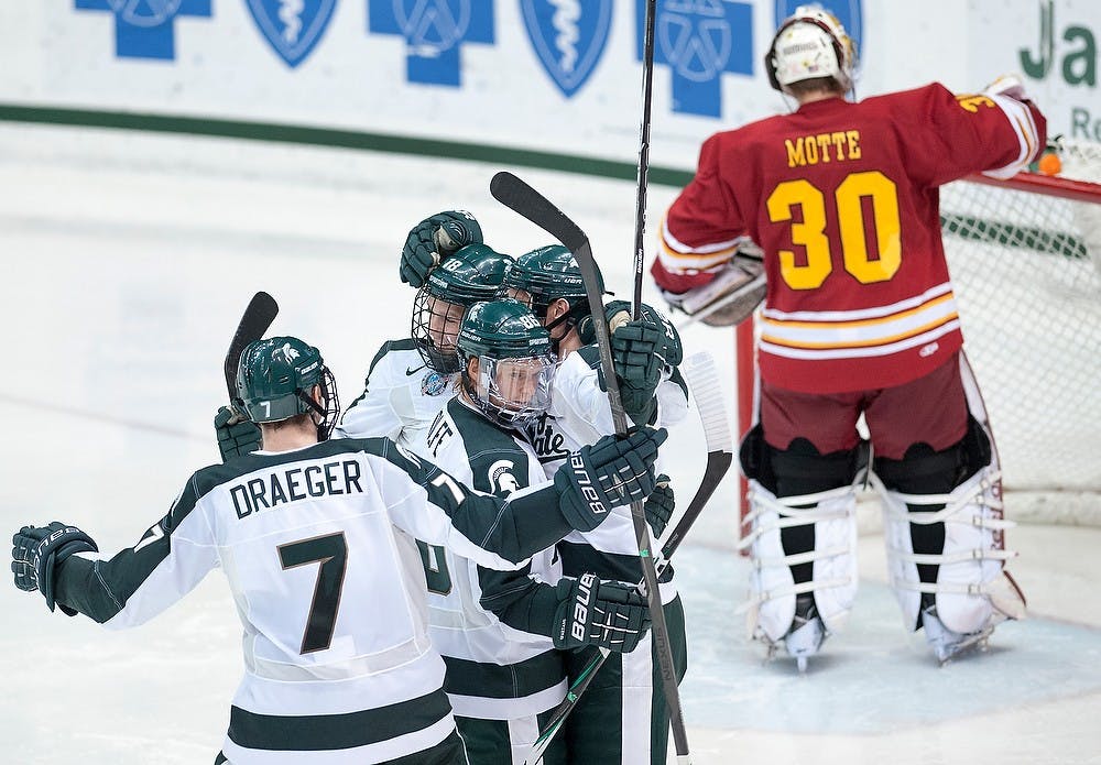 	<p>Spartan players celebrate senior forward Chris Forfar&#8217;s goal in front of Ferris State goaltender CJ Motte. The Spartans defeated the Bulldogs, 3-1, Saturday, Dec. 15, 2012, at Munn Ice Arena. Justin Wan/The State News</p>