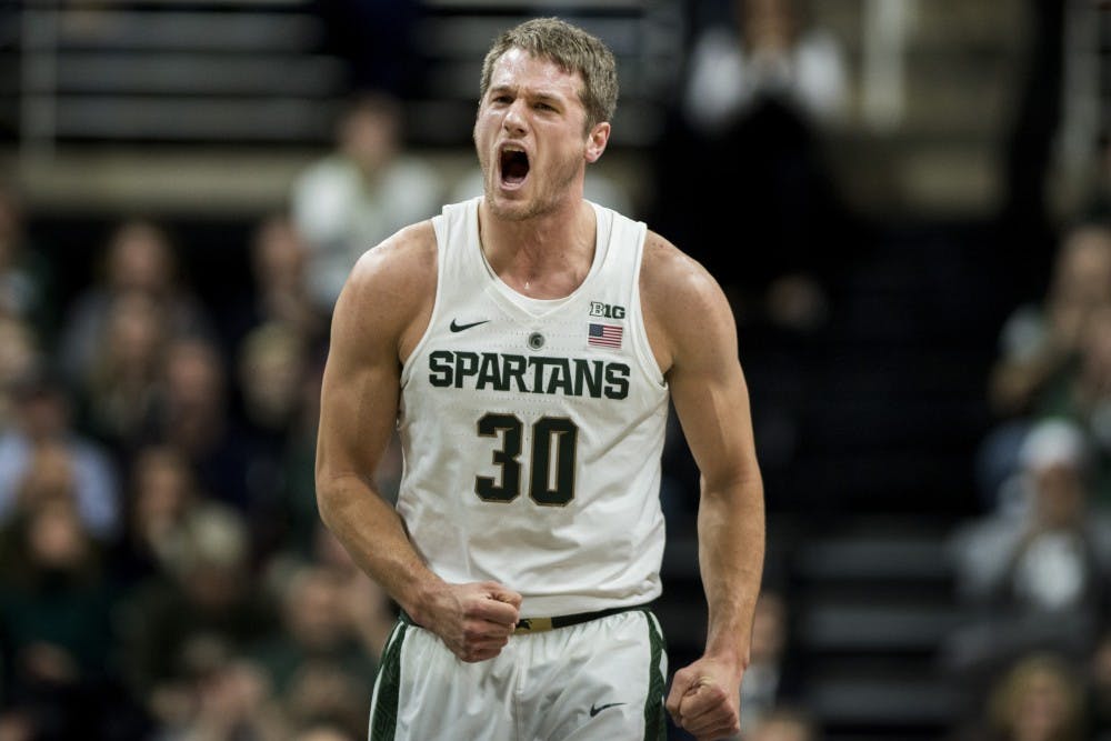 Senior forward Matt Van Dyk (30) celebrates after a play during the first half of the game against Northeastern on Dec. 18, 2016 at Breslin Center. The Spartans were defeated by the Huskies, 73-81. 