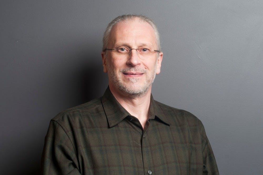 East Lansing council member Erik Altmann poses for a portrait on March 2, 2017. Altmann is also a psychology professor at MSU. 