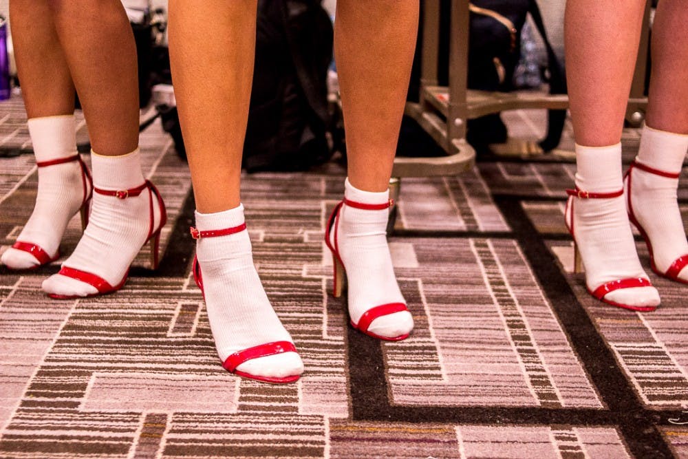  Models wait backstage during the VIM fashion show on April 22, 2018 at the Marriot Hotel on 300 M.A.C. Ave. in East Lansing. The fashion show featured students from VIM, the campus fashion magazine and collections from student designers. 