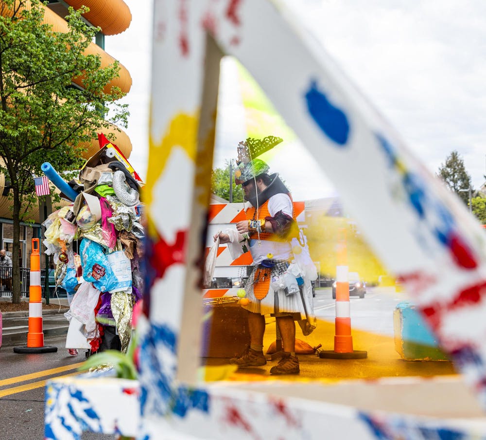 <p>A group of people dressed up in outfits covered with random items at the 63rd East Lansing Art Festival in East Lansing, Mich., on May 16, 2026.</p>
