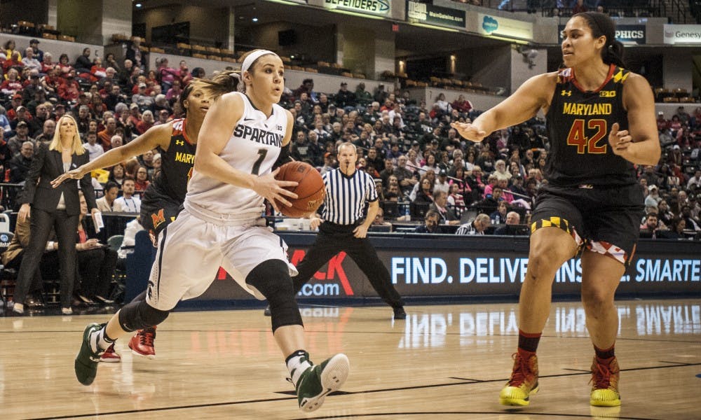 <p>Senior guard Tori Jankoska (1) goes up for a lay up as Maryland center Brionna Jones (42) defends her during the game against the Maryland in the semifinal round of the women's Big Ten Tournament on March 4, 2017 at Bankers Life Fieldhouse in Indianapolis. The Spartans were defeated by the Terrapins, 100-89.</p>