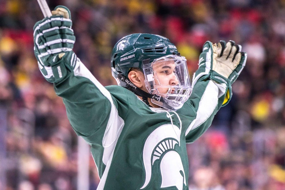 Sophomore forward Taro Hirose (17) celebrates his goal during the game against Michigan on Feb. 10, 2018, at Little Caesars Arena. The Spartans fell to the Wolverines, 3-2.