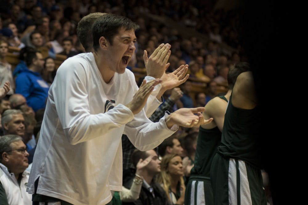 Freshman guard Connor George (41) reacts to the team scoring a basket during the second half of the game against Duke on Nov. 29, 2016 at Cameron Indoor Stadium in Durham, N.C. The Spartans were defeated by the Blue Devils, 69-78. 