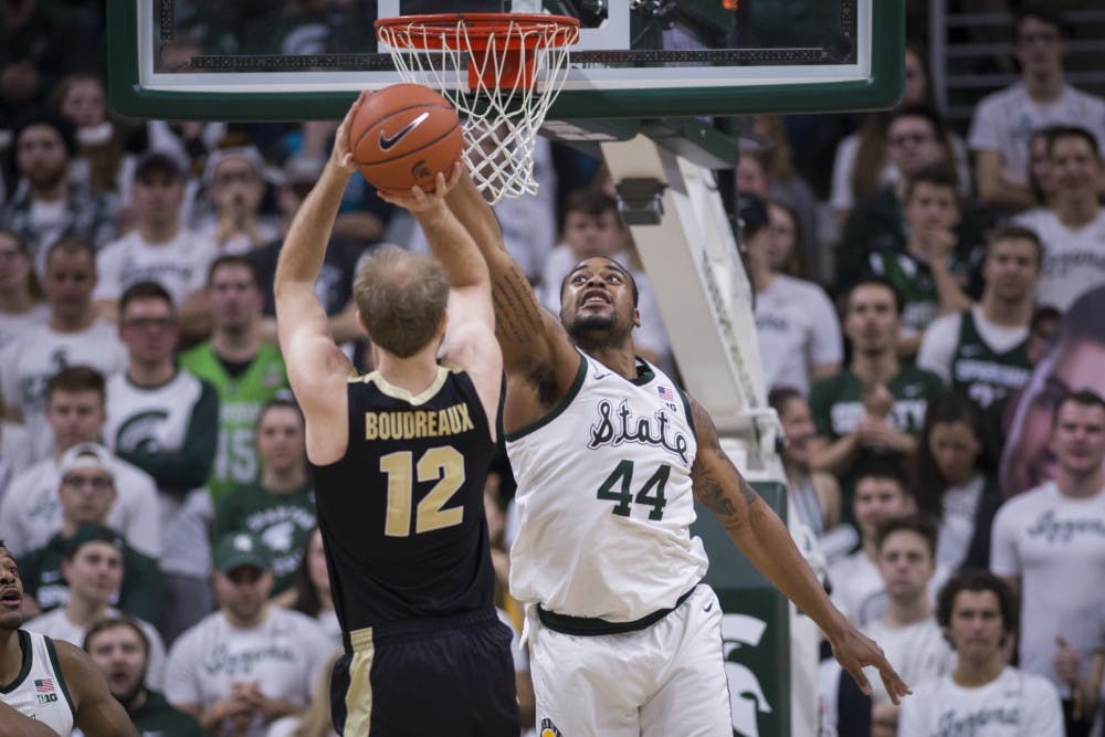 Junior forward Nick Ward (44) blocks a shot by Purdue forward Evan Boudreaux (12) during the first half of the men's basketball game against Purdue on Jan. 8, 2018 at Breslin Center. The Spartans defeated the Boilermakers, 77-59.