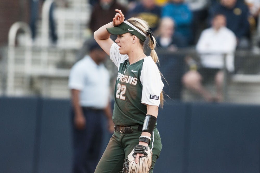 <p>Junior second-baseman McKenzie Long (22) looks to the field during the game against University of Michigan on April 18, 2017 at Wilpon Baseball and Softball Complex in Ann Arbor. The Spartans were defeated by the Wolverines, 3-1.</p>