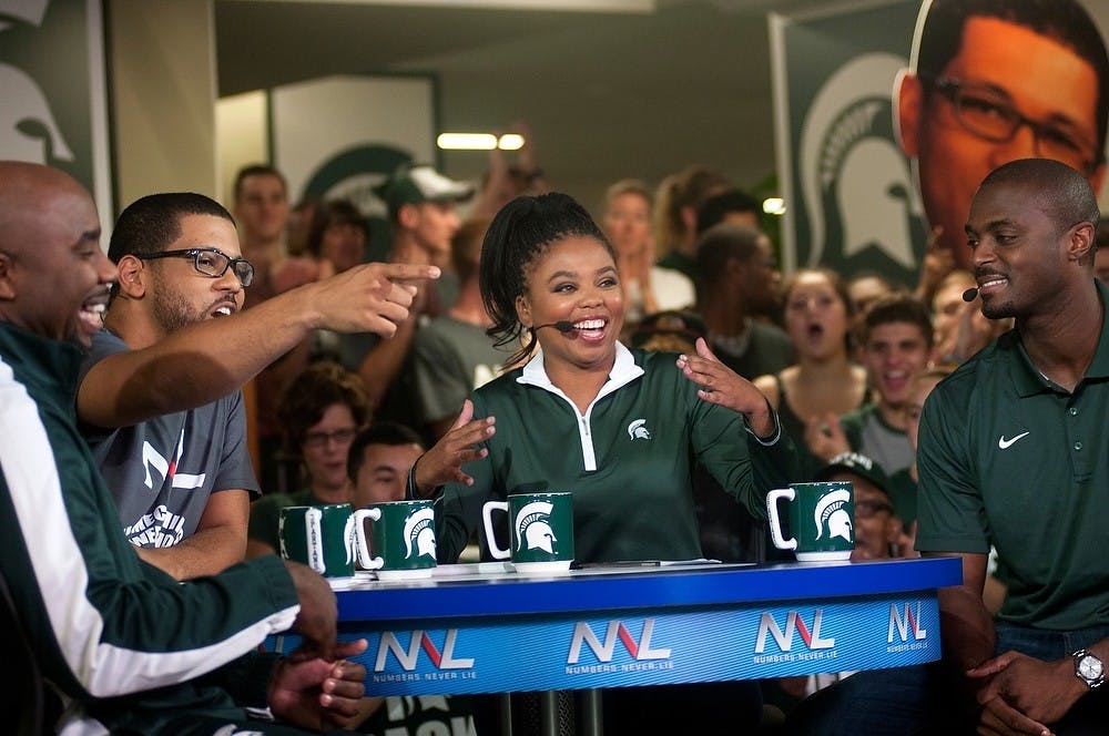 From left to right, former MSU basketball player Mateen Cleaves, ESPN's Michael Smith, MSU alumna and former State News reporter ESPN's Jemele Hill and former MSU football player Plaxico Burress tape ESPN2's "Numbers Never Lie" on Sept. 26, 2014, at the Union. Raymond Williams/The State News

