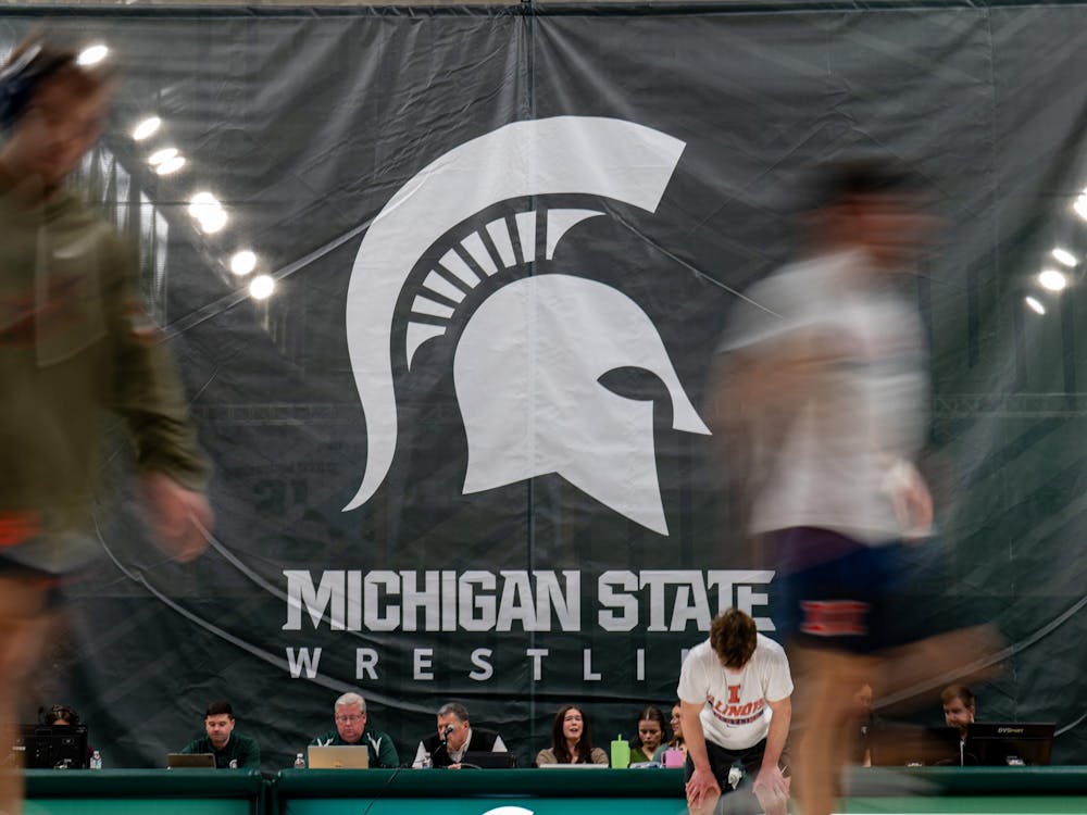 <p>The Michigan State wrestling banner hangs over the score table as wrestlers warm up ahead of a dual against Illinois at Jenison Field House in East Lansing on Friday, Jan. 16, 2026.</p>