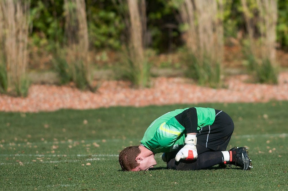 <p>Junior goal keeper Zach Bennett screams into the ground in frustration after a Michigan goal Nov. 2, 2014, at DeMartin Stadium at Old College Field. The Spartans lost, 3-2. Julia Nagy/The State News</p>