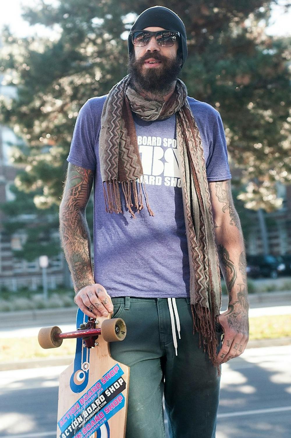 	<p>East Lansing resident Brian Zygmontowicz poses for a portrait with his longboard on Nov. 19, 2013, outside of Campus Town Mall on Grand River Avenue. His trip, called Ziggy&#8217;s Breast Quest, involves him riding across the country to promote cancer awareness.</p>