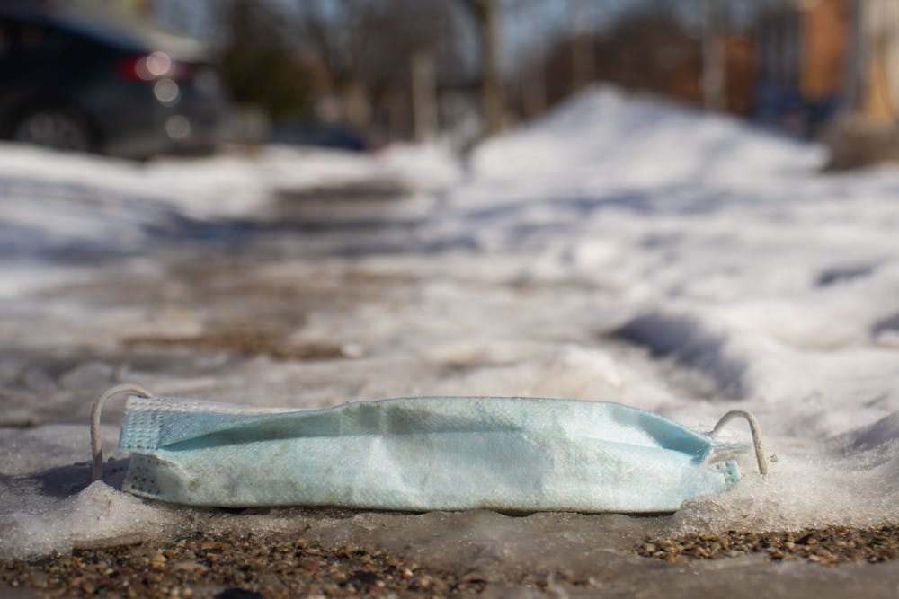 Discarded mask left on a sidewalk in East Lansing on Feb 20, 2022